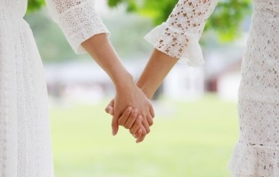 Holding hands at wedding ceremony