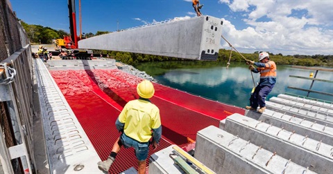 Construction workers on Cudgen Creek bridge with crane