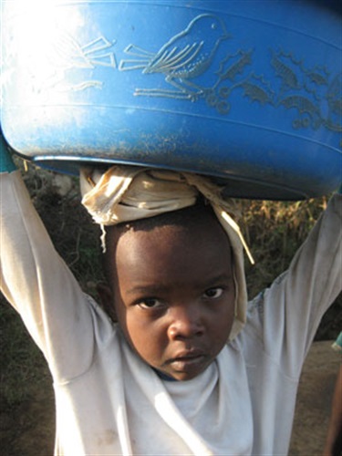 Girl carrying washing