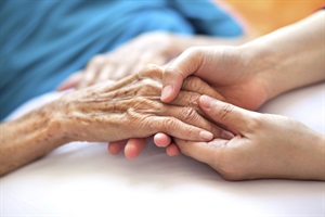 Young hands holding older hands