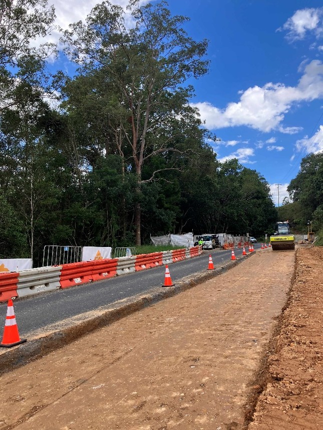 Compaction works are underway on the upslope lane of the Tyalgum Road slip site.