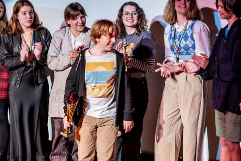 Boaz Blennerhassett with his trophy for winning the Poets Out Loud Youth Slam.jpg