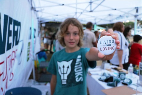 Boy holding badge - living and loving the Tweed