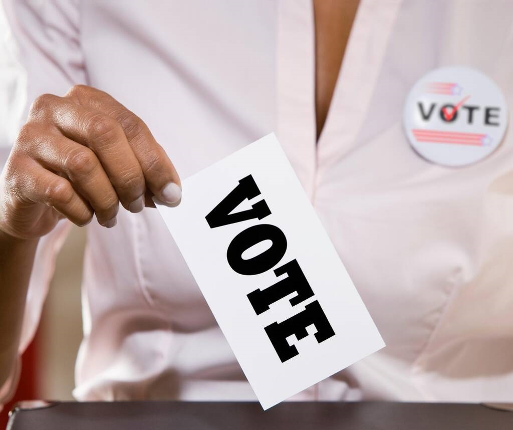 Person holding vote card for elections