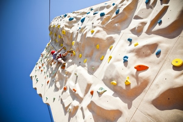 child on rock climbing wall